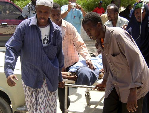 A Somali woman is wheeled into the Medina hospital after being wounded by a mortar shell after a mortar attack on the Mogadishu International Airport, Wednesday, Jan. 24, 2007. Gunmen launched several mortars at Mogadishu International Airport on Wednesda (AP Photo/Mohamed Sheikh Nor)
