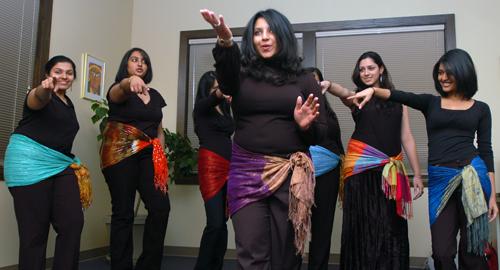 Senior in LAS Rosemary Thariath leads the a capella group Illini Chandani in song at the South Asian Art Night at the Asian American Cultural Center Wednesday night. The event featured traditional South Indian cuisine, South Indian art, as well as music a ME Online
