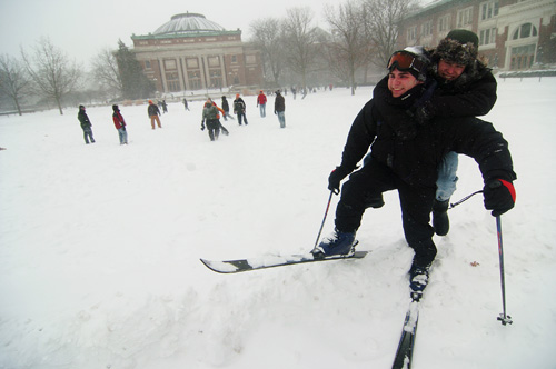 On skis, Scott Malinowski of Champaign and Brett Loman, freshman in ACES, trudge through the Quad Tuesday afternoon. Nothing can get better than skiing on the Quad, Malinowski said. Adam Babcock
