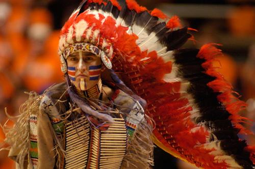 Dan Maloney, portrayer of Chief Illiniwek, performs the half-time dance. The Chief made his final perfomance Feb. 21. Beck Diefenbach
