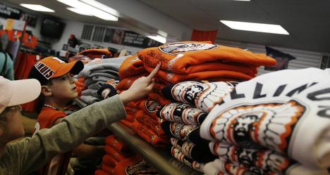 10-year-old Jacqueline Johnson, left, points out a sweatshirt to her 6-year-old brother Noah in Gameday Sports at 519 E Green St, Champaign, Ill., Friday, March 30, 2007. Tracy Johnson drove her children down from Crystal Lake to buy Illini gear over the Adam Babcock
