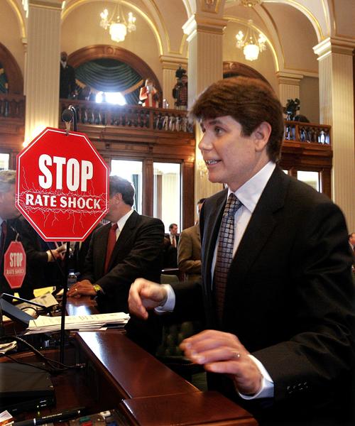 Illinois Gov. Rod Blagojevich stops to speak to members on the Democratic side of the House chambers after delivering the State of the State address to a joint session of the General Assembly at the Illinoios State Capitol in Springfield, Ill., Wednesday, The Associated Press
