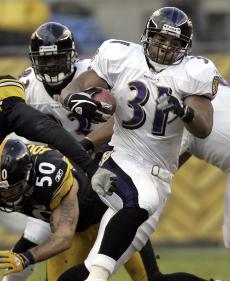 Baltimore Ravens running back Jamal Lewis gets past Pittsburgh Steelers linebacker Larry Foote, left, during the first half of a game against Pittsburgh on Dec. 24, 2006. The Associated Press
