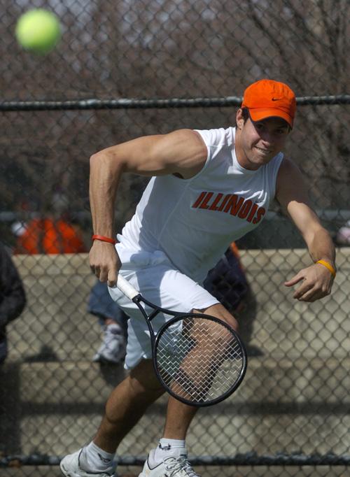 Marc Spicijaric chases a ball against Wisconsin at the Atkins Tennis Center, Sunday. Spicijaric won both his doubles and singles matches. ME Online
