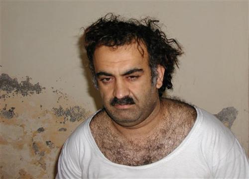 In a file photo Khalid Sheikh Mohammed, the alleged Sept. 11 mastermind, is seen shortly after his capture during a raid in Pakistan Saturday March 1, 2003, in this photo obtained by the Associated Press. Mohammed confessed to that attack and a string of The Associated Press
