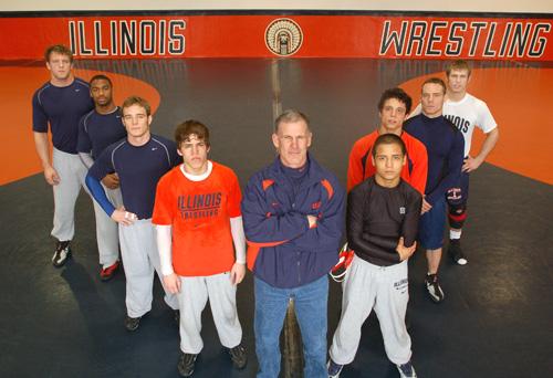 The Illinois wrestling team starters and head coach Mark Johnson, center, pose for a picture during practice at Huff Hall on Thursday afternoon. Johnson will lead his team to East Lansing, Mich., later today for the 2007 Big Ten Championship. Beck Diefenbach
