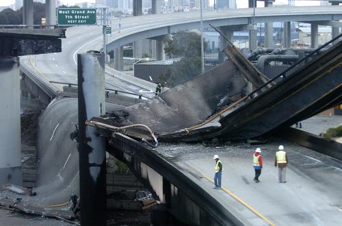 A section of highway lies crumbled in Emeryville, Calif., after a tanker carrying gasoline exploded on Sunday. In the resulting blaze, a section of freeway that funnels traffic onto the San Francisco-Oakland Bay Bridge collapsed. Noah Berger, AP
