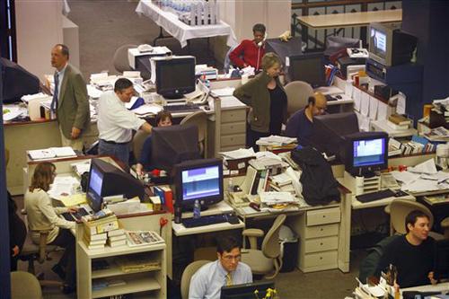 The city and photo desks at the Chicago Tribune are shown Thursday, March 29, 2007, in Chicago. Tribune Co. has accepted a buyout offer from real estate investor Sam Zell in a deal valued at about $8.2 billion and plans to sell the Chicago Cubs at the end Drake Baer
