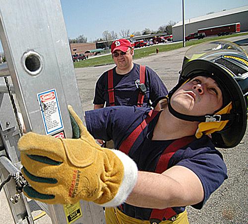 Recruit Kyle Liceaga, junior in Communications, attempts to position a ladder for his first time at the Illinois Fire Service Institute at 11 Gert Drive in Champaign on April 22. Beck Diefenbach

