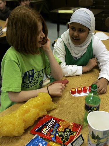 Clague Middle School students Jessa Gargan, left, and Zahra Al-hasnawy look over props used in a health program in their classroom in Ann Arbor, Mich., last Thursday. Healthy Schools, a collaborative program between Ann Arbor public schools and the Univer Carlos Osorio, AP
