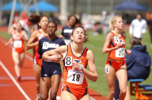 Angela Bizzarri finishes a run during the Illinois Invitational at the Outdoor Track and Soccer Stadium on Sunday. Beck Diefenbach
