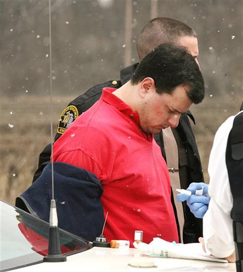 Anthony LaCalamita is arrested following a high-speed chase on Interstate 75 in south Bay County near Detroit, Mich., Monday, April 9, 2007. LaCalamita is suspected of shooting three people Monday at an accounting firm in Troy, Mich. The Associated Press
