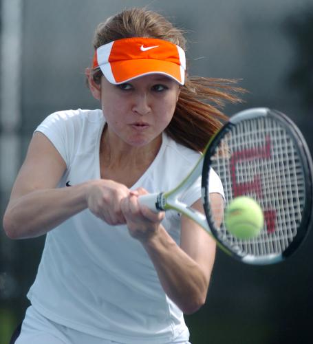 Momei Qu returns a serve against Michigan State on Sunday, March 25, 2007 at Atkins Tennis Center. Beck Diefenbach
