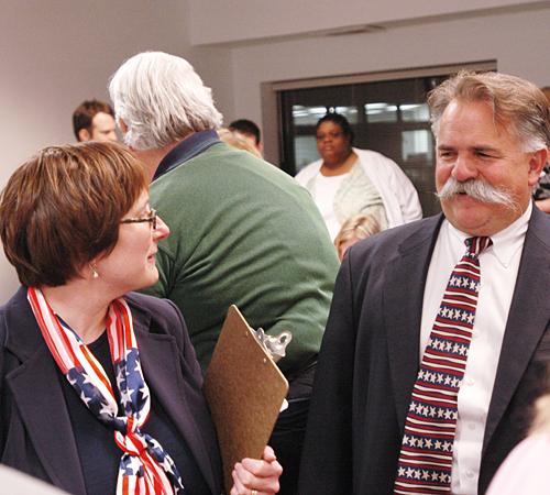 Champaign City Council candidates Deborah Feinen and Thomas Bruno await election results at the Brookens Administrative Center. Beck Diefenbach
