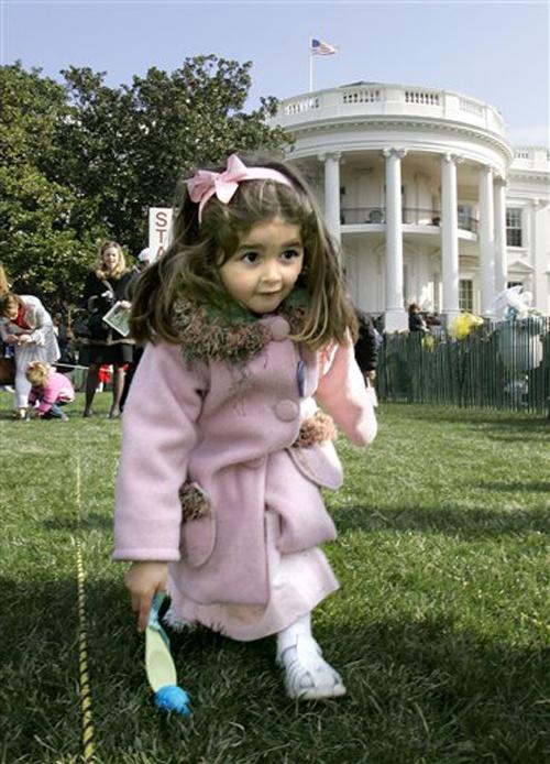 Maddie Lloyd, 4, from Richmond, Va., rolls an Easter egg during the annual White House Easter Egg Roll, hosted by first lady Laura Bush, not pictured, on the South Lawn of the White House in Washington, Monday, April 9, 2007. The Associated Press
