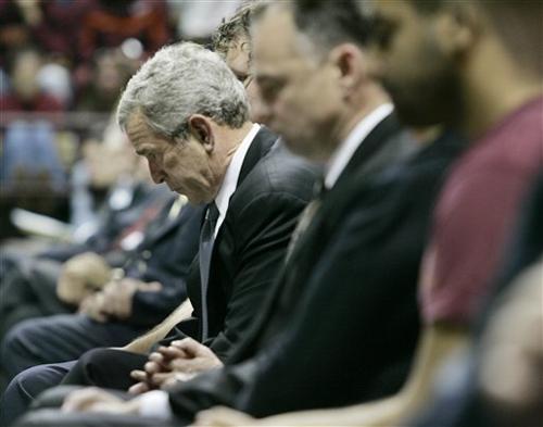 President Bush bows his head during a convocation ceremony in honor of Virginia Tech massacre victims, Tuesday, April 17, 2007, in Blacksburg, Va. The Associated Press
