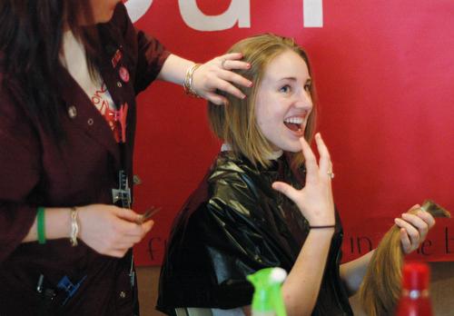 Katie McMillen, junior in Engineering, gets her hair cut at the Illini Union for the Locks of Love charity. The donated hair is used to make wigs for cancer victims. I have this and I can give it, so I should, McMillen said. Beck Diefenbach
