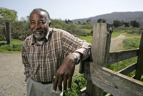 John Francis stands near a path he often walks near his office in Point Reyes Station, Calif., March 21. Eric Risberg, AP
