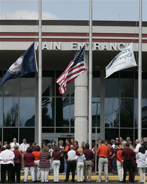 Hospital staff gather outside the front entrance at the Montgomery General for a moment of mourning for the slain Virginia Tech students in Blacksburg, Va., Friday, April 20, 2007. The Associated Press
