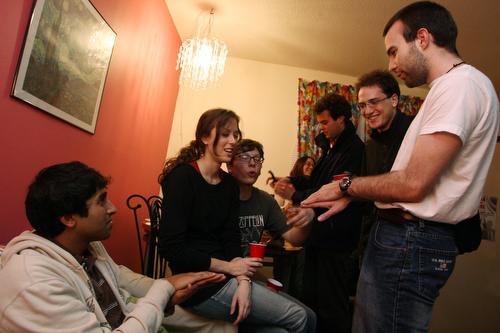 As part of the Buddy Program, American students who studied abroad and international exchange students jokingly discuss finger puppets as they come together and share their experiences. Charles Rex Arbogast, AP
