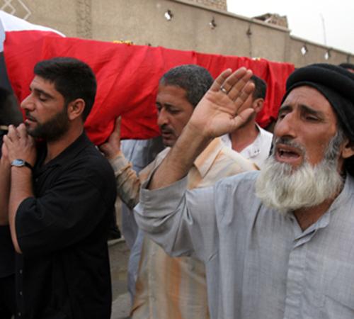 Friends and relatives take part in the funeral procession for Abdul Hussein Abdul, in Sadr City Shiite district in Baghdad, Iraq, Friday. Abdul Hussein Abdul was killed in sectarian violence in southern Baghdad. The Associated Press
