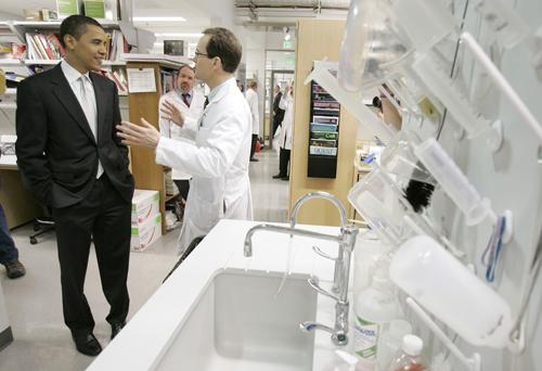 Democratic presidential hopeful U.S. Sen. Barack Obama, D-Ill., talks with Dr. Mark Anderson while touring a cardiology research lab before speaking about his health care plan, Tuesday, May 29, 2007, at the University of Iowa in Iowa City, Iowa. Obama on The Associated Press
