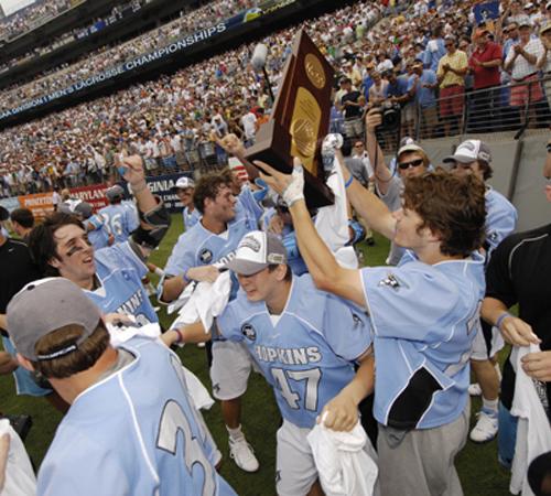 Johns Hopkins players celebrate with the trophy after they beat Duke 12-11 to win the NCAA Division I Championship lacrosse game, Monday, May 28, 2007, in Baltimore.( The Associated Press
