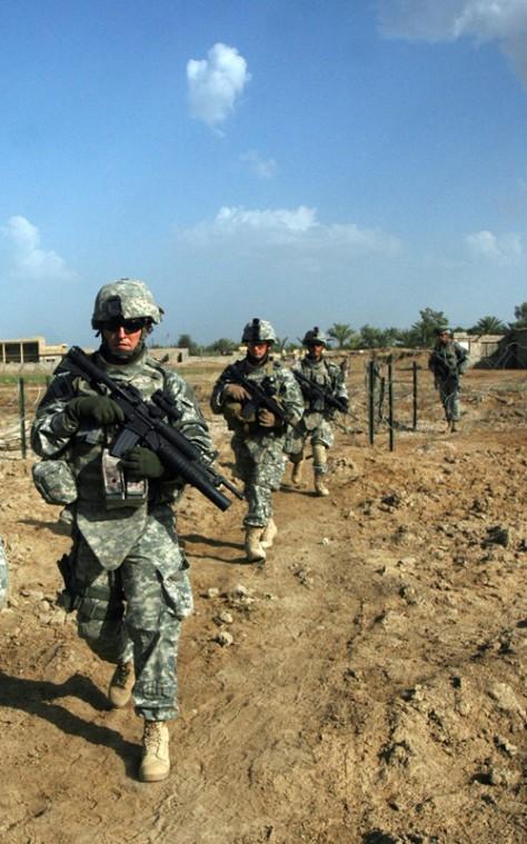 In this handout photo released by the U.S. Army on Tuesday, Soldiers of the 4th Battalion, 31st Infantry Regiment, 2nd Brigade Combat Team, 10th Mountain Division (Light Infantry) out of Fort Drum, N.Y., search fields in Rushdi Mullah, Iraq for three miss The Associated Press
