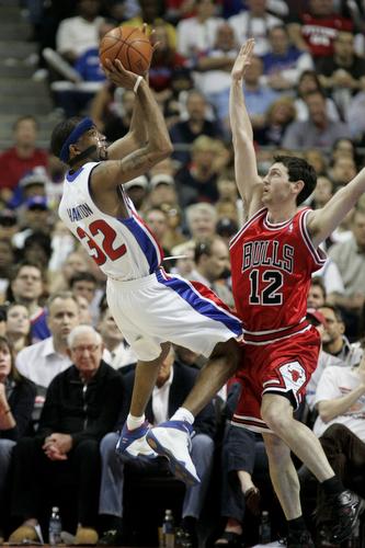 Detroit Pistons guard Richard Hamilton (32) shoots over the defense of Chicago Bulls guard Kirk Hinrich (12) during the first quarter of an NBA basketball playoffs second-round series at the Palace of Auburn Hills, Mich., on Saturday. Duane Burleson, AP
