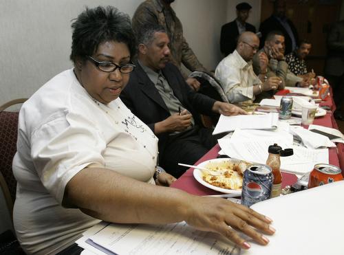 Aretha Franklin checks information during an open audition for the musical "Aretha: From these Roots" in Southfield, Mich., Tuesday. The stage production is expected to open in Detroit next spring. Paul Sancya, AP
