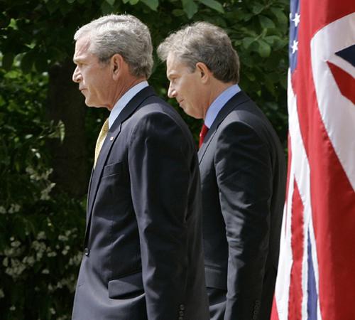 President Bush, left, and outgoing British Prime Minister Tony Blair walk from the Oval Office of the White House in Washington, Thursday to their joint press conference in the Rose Garden. The Associated Press
