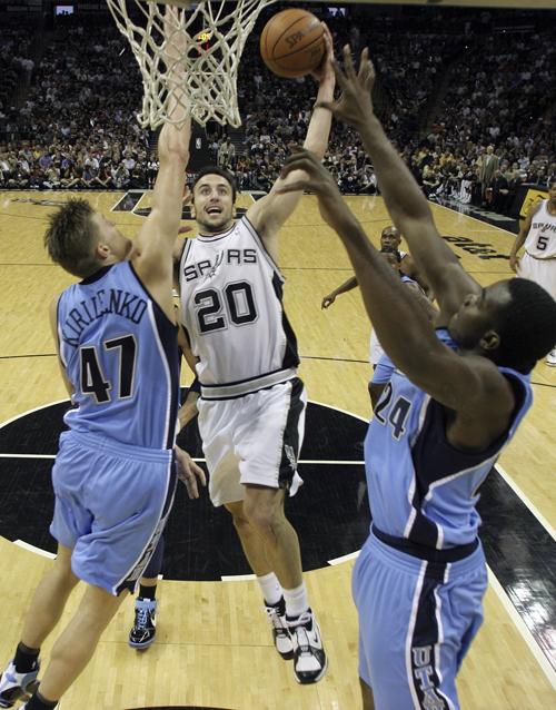 San Antonio Spurs forward Manu Ginobili (20) is defended by Utah Jazz forward Andrei Kirilenko (47), of Russia, during the first half of their Western Conference Finals NBA basketball game in San Antonio, Wednesday, May 30, 2007. The Associated Press
