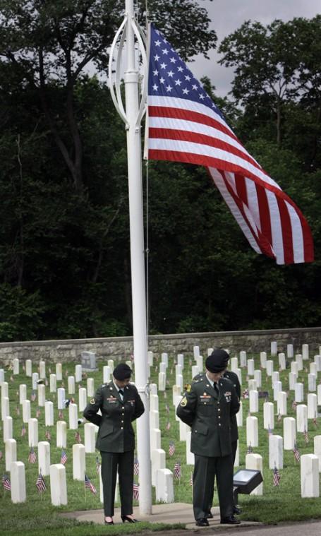 Color guard stand during Memorial Day ceremonies at the Post Cemetery in Fort Riley, Kan., Monday, May 28, 2007. The Associated Press
