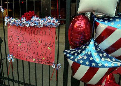 A memorial to St. Louis Cardinals baseball relief pitcher Josh Hancock has been placed along the third base gate at Busch Stadium in St. Louis Monday, April 30, 2007, by fans. Hancock lost his life in a traffic accident early Sunday morning when his sport The Associated Press
