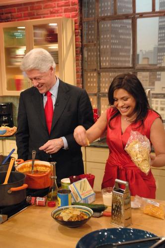 This photo provided by "Rachael Ray" shows former President Bill Clinton and the celebrity chef during a taping of her show, April 12. Clinton and Ray announced the launch of a charitable group that aims to help children eat healthier at home and in schoo Rachael Ray, AP
