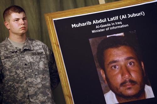 A soldier stands next to a picture of Muharib Abdul-Latif al-Jubouri at a press conference in Baghdad given by US Maj. Gen. William Caldwell, spokesman of the Multi-National Force Iraq, in Baghdad on Thursday. Ahmad al-Rubaye, AP
