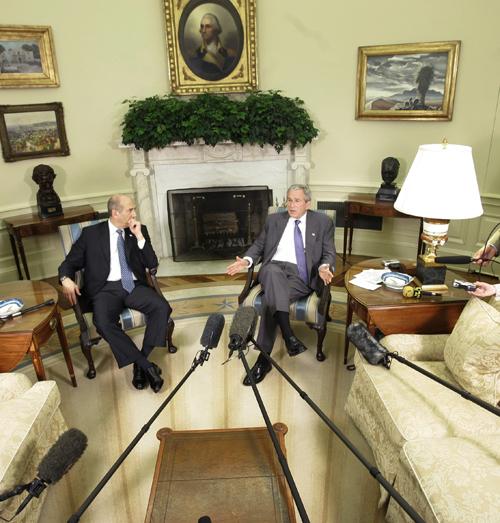 President Bush, right, meets with Israeli Prime Minister Ehud Olmert in the Oval Office of the White House in Washington, Tuesday, June 19, 2007. (AP Photo/Gerald Herbert) Phil Collins
