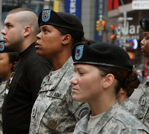 Newly enlisted Army recruits, in black shirts, join recruiting officers in a ceremony in New York in this Sept. 22, 2006, file photo. According to data obtained by The Associated Press, the number of blacks joining the U.S. military has plunged by more th Bernadette Tuazon, The Associated Press
