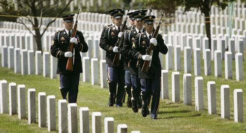 Members of the Military Firing Party march in formation past gravestones after participating in funeral services for Cpl. Joseph John Anzack, Jr. of Torrance, Calif., Wednesday, June 6, 2007, at Arlington National Cemetery in Arlington, Va. The death toll The Associated Press
