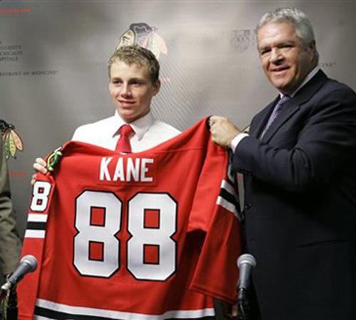 Patrick Kane, the No. 1 pick of the 2007 NHL draft, holds up his jersey as he is introduced to the media by Chicago Blackhawks head coach Denis Savard, left, and General Manager Dale Tallon, right, at a news conference Monday, June 25, 2007, in Chicago. Charles Rex Arbogast, The Associated Press
