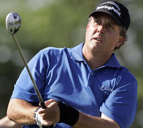 Phil Mickelson, wearing an elastic band on his injured left wrist, tees off at the fifth hole during his practice round for the 107th U.S. Open Golf Championship at the Oakmont Country Club in Oakmont, Pa., on Tuesday. The Associated Press
