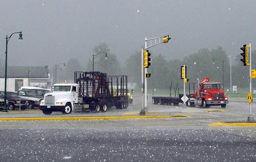 Hail the size of baseballs fall from the sky in Wisconsin Rapids, Wis., as severe storms rip through the area Thursday, June 7, 2007. Many windows were broken in the area. Heavy thunderstorms that packed baseball-sized hail, 60 mph (96.5 Kilometers) winds The Associated Press
