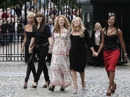 The re-united Spice Girls, Victoria Beckham, Melanie Chisholm, Geri Halliwell, Emma Bunton and Melanie Brown pose for the photographers on the grounds of the Royal Observatory in Greenwich, London, Thursday. (AP Photo/Lefteris Pitarakis) Phil Collins
