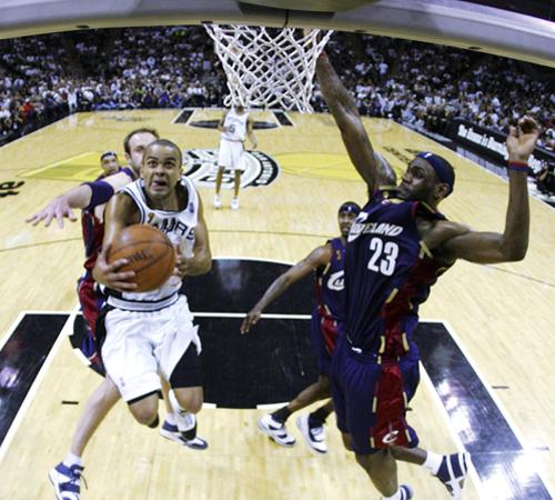 San Antonio Spurs guard Tony Parker (9), of France, shoots in front of Cleveland Cavaliers forward LeBron James (23) in the fourth quarter of Game 2 of the NBA Finals basketball game in San Antonio, Sunday, June 10, 2007. Parker scored 30 points in the 1 The Associated Press
