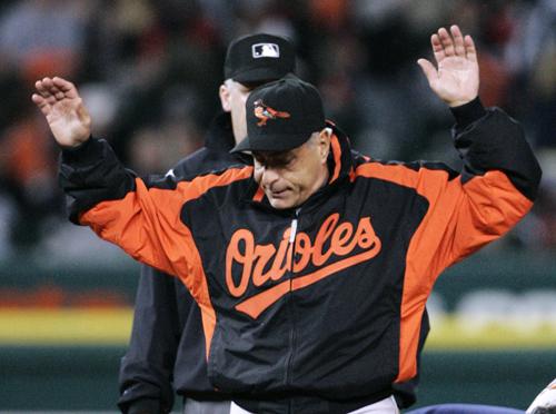 Orioles manager Sam Perlozzo ends an argument with an umpire. Perlozzo was fired on Monday. Duane Burleson, The Associated Press
