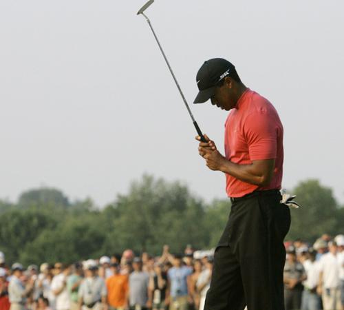 Tiger Woods looks down his ball inches away from the cup after missing an opportunity to tie Angel Cabrera in the final round of the 107th U.S. Open Golf Championship at the Oakmont Country Club in Oakmont, Pa., on Sunday. Elise Amendola, The Associated Press
