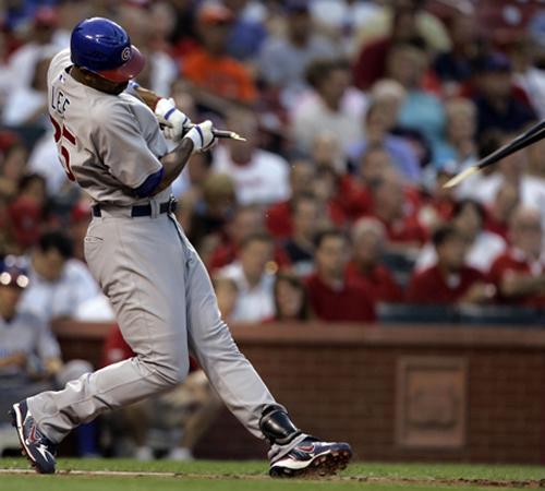 Derrek Lee breaks his bat during the fourth inning against the Cardinals on Tuesday in St. Louis. Lee, playing for the first time since his suspension, added two hits. Jeff Roberson, The Associated Press
