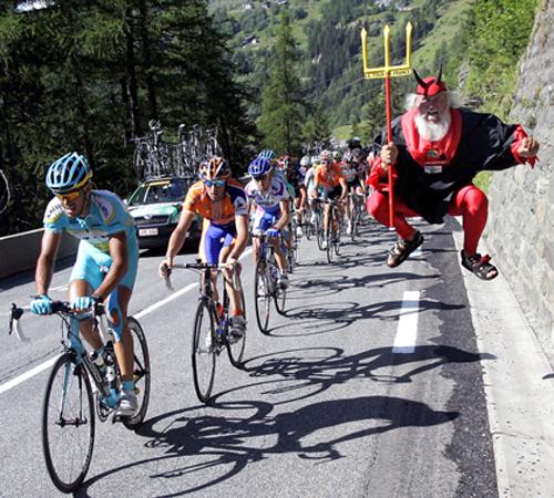 Didi Senft of Germany, aka El Diablo, clowns about as the pack passes by in the downhill of Tignes during the 8th stage of the 94th Tour de France between Le Grand Bornand and Tignes, French Alps, on Sunday. No clear frontrunner has surfaced y Christophe Ena, The Associated Press
