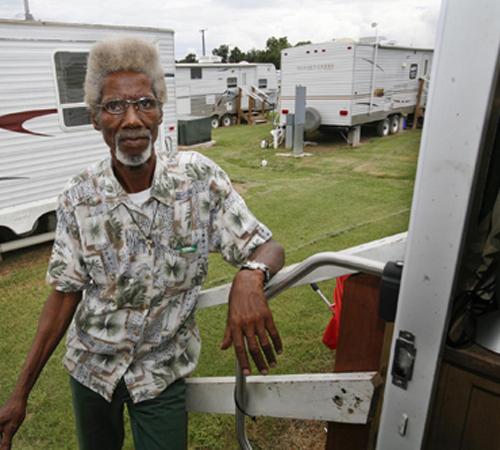 Wilbert Ross stands at the doorway of his Federal Emergency Management Agency trailer Friday in Baker, La. Ross moved to a FEMA trailer park after Hurricane Katrina chased him from New Orleans in 2005. Tim Mueller, The Associated Press

