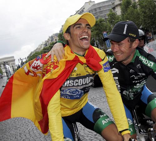 Tour de France winner Alberto Contador of Spain, left, reacts as he rides down the Champs-Elysees with teammate Sergio Paulinho of Portugal after the 20th and final stage of the 94th Tour de France on Sunday. Christophe Ena, The Associated Press
